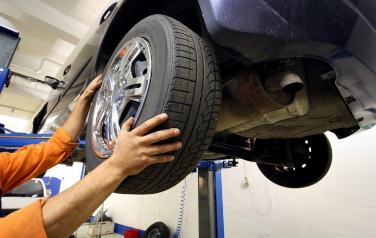 mechanic changing a car wheel